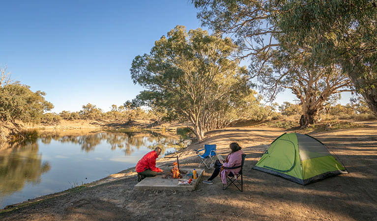 Campers around their campfire at campsite 11, Darling River campground. Photo: John Spencer/DPIE