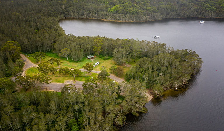 Aerial view of Violet Hill campground and picnic area with surrounding bushland and waterways in Myall Lakes National Park. Photo: John Spencer &copy; DPE