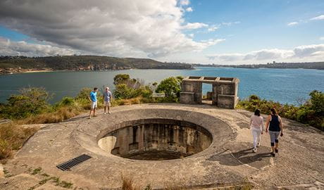 People walking around Middle Head – Gubbuh Gubbuh's military fortifications in Middle Head, Sydney Harbour National Park. Photo: John Spencer, &copy; DCCEEW